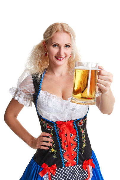Beautiful young blond girl of oktoberfest beer stein - Photo, image