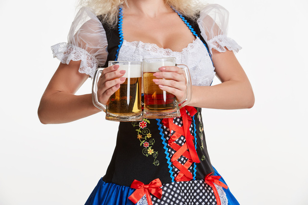 Beautiful young blond girl of oktoberfest beer stein - Photo, Image