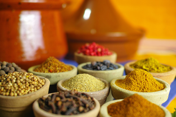 Collection of different spices in old clay bowls in colorful oriental style - Photo, Image