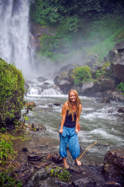 Young woman near waterfall, bali - Photo, image