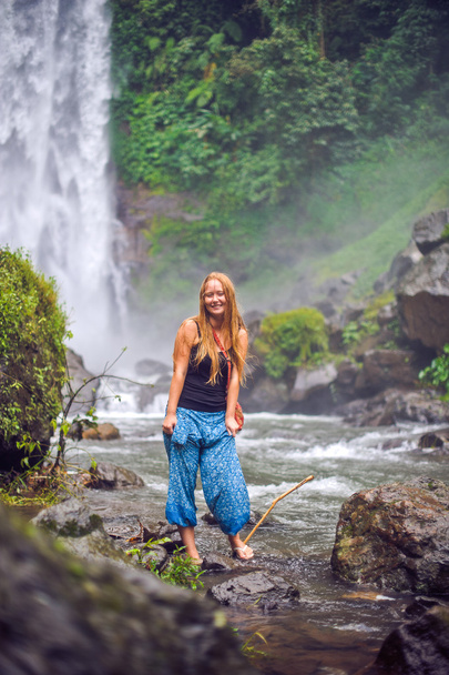 Young woman near waterfall, bali - Fotoğraf, Görsel