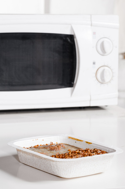 Microwave oven with frozen food - Photo, Image