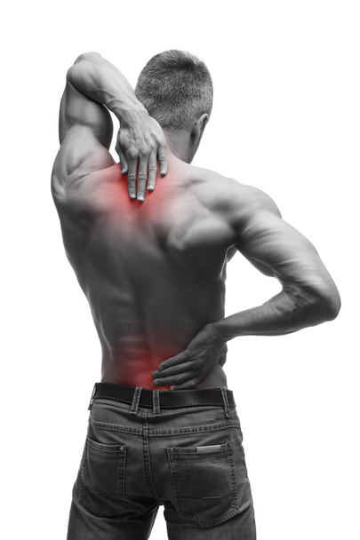 Middle aged man with back pain, muscular male body, studio isolated shot on white background with red dot - Foto, Bild