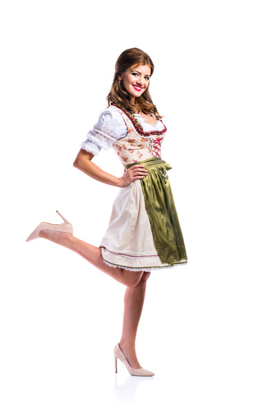 Beautiful woman in traditional bavarian dress, studio shot - Zdjęcie, obraz