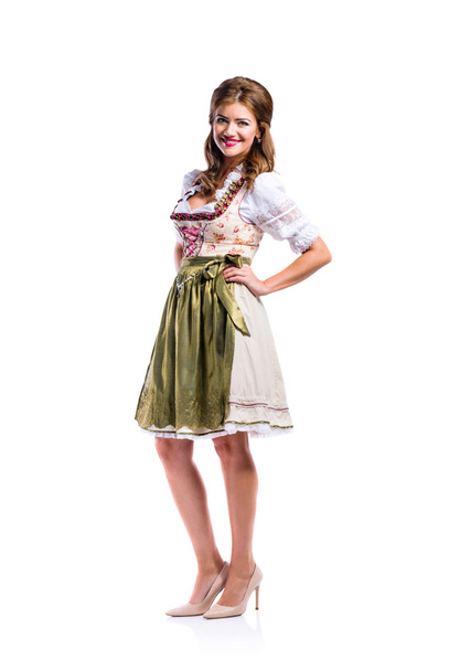 Beautiful woman in traditional bavarian dress, studio shot, isol - Photo, image