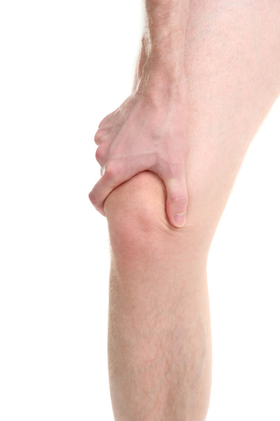 Man holding sore knee, isolated on white - Foto, imagen