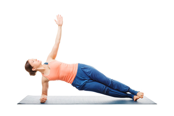 Woman doing yoga asana Vasisthasana - side plank pose - 写真・画像
