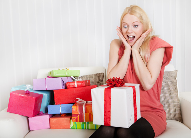 Beautiful young woman with her presents - Foto, afbeelding