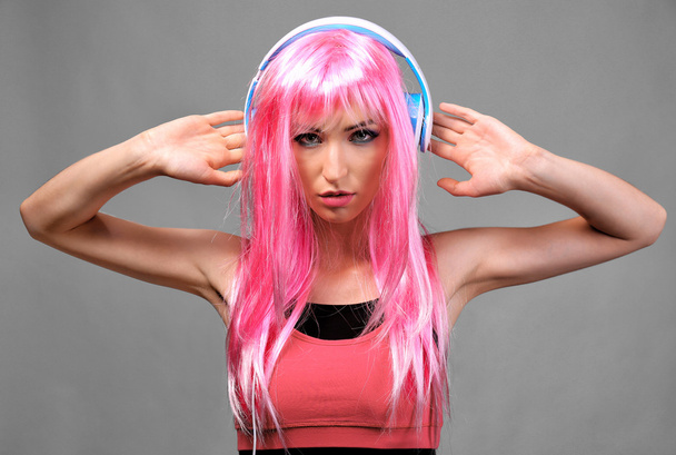 Glamour young woman with headphones on grey background - Zdjęcie, obraz