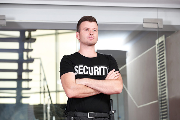 Security man standing back - Foto, imagen