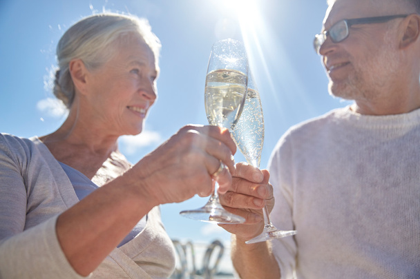 happy senior couple drinking champagne outdoors - Φωτογραφία, εικόνα