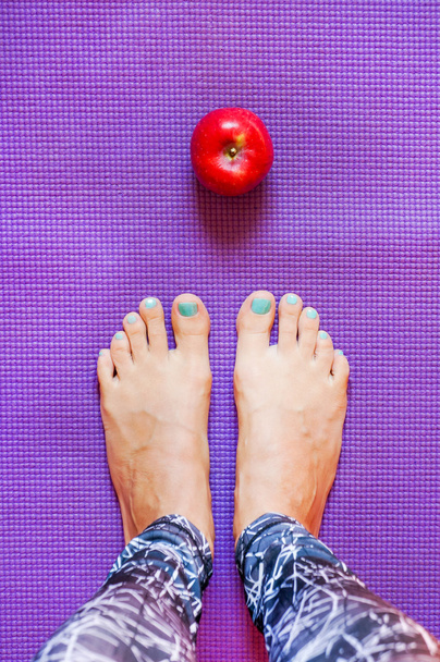 Yoga legs on mat - Foto, afbeelding