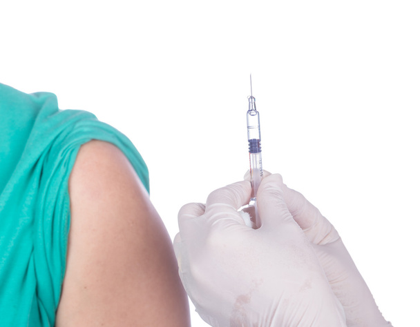 nurse with syringe giving a vaccine for a patient  - Fotó, kép