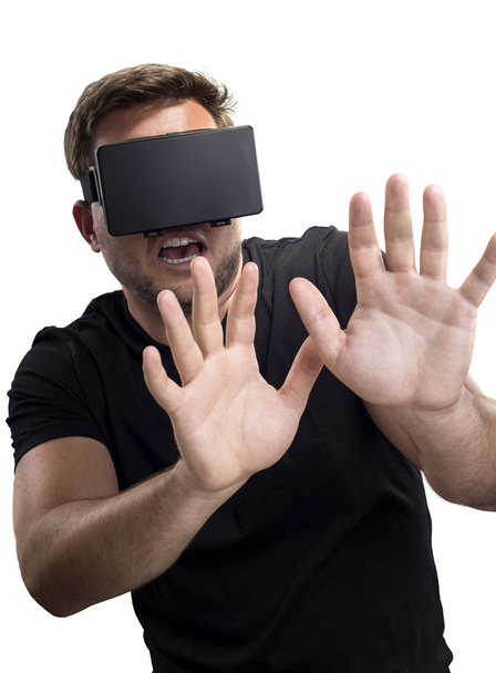 Man wearing a Virtual Reality headset - Fotó, kép