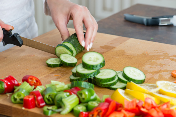sliced cucumber with a knife macro - Foto, Imagem