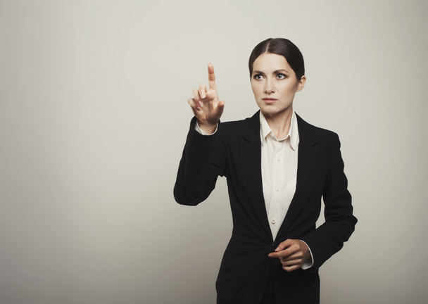 Businesswoman pressing button or something iIsolated with copy s - Foto, Imagen