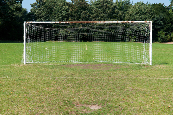 Football goal posts and net on a soccer pitch - Fotoğraf, Görsel