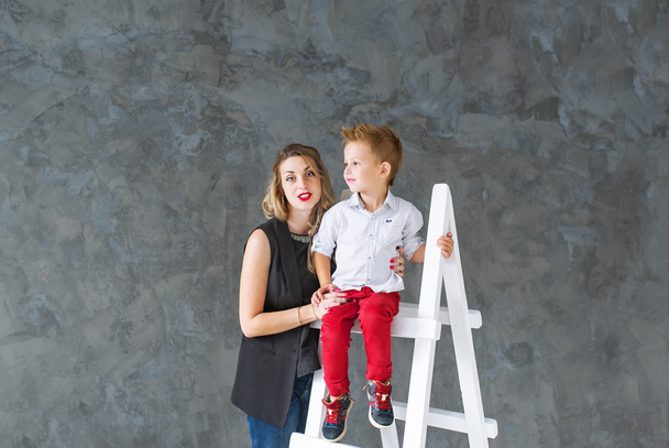 Mother and blond son on a step-ladder - Φωτογραφία, εικόνα
