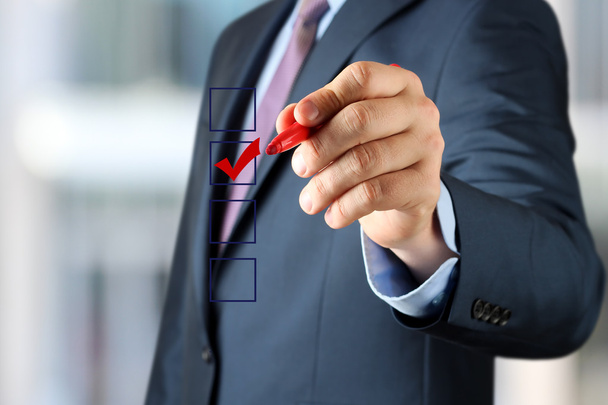 Businessman  making vote  by  a red  pen - Photo, Image