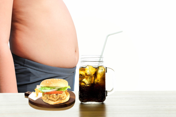 Chicken burger and fizzy drink with fat boy  - Фото, зображення