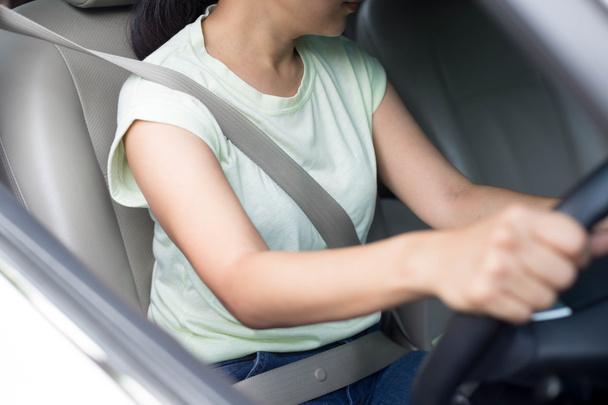 asian woman driving a car with seat belt on for safety  - Valokuva, kuva