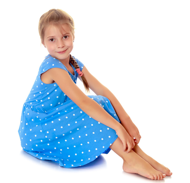 Little girl in a blue dress - Φωτογραφία, εικόνα
