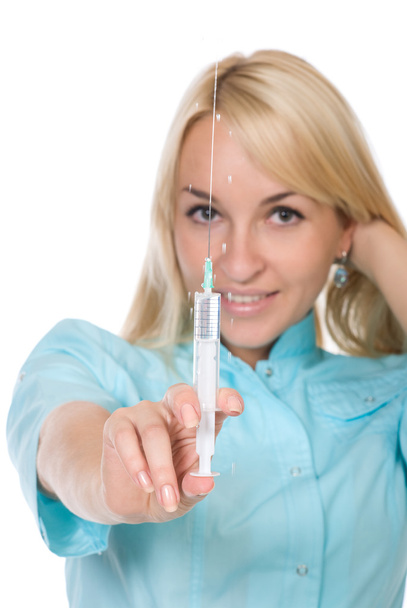 Young attractive nurse holding syringe - Foto, imagen