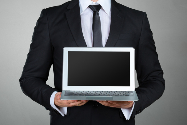 businessman holding laptop - Φωτογραφία, εικόνα