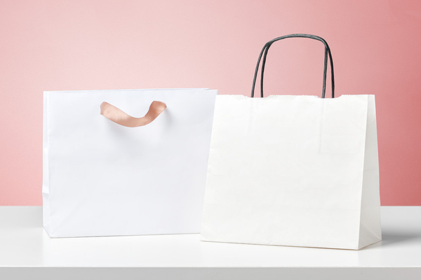 different shopping bags on white desk - Foto, Imagem