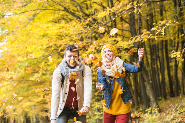 couple on walk in autumn forest - Photo, image