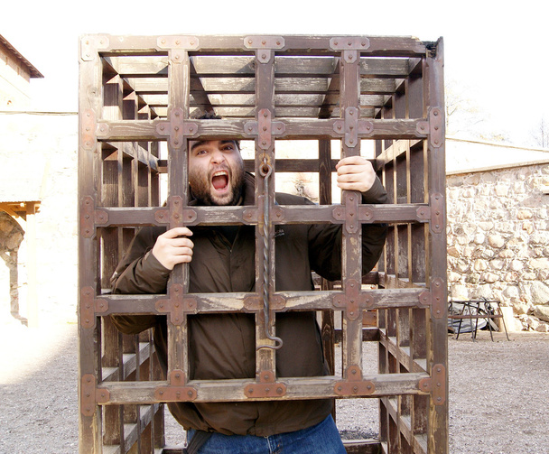 man arrested in medieval cage - Photo, Image