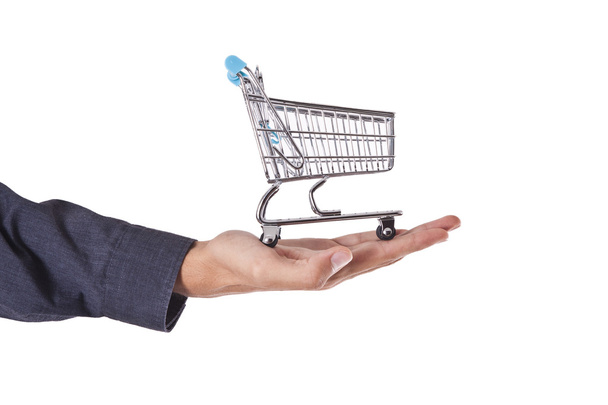 hand with shopping cart - Zdjęcie, obraz