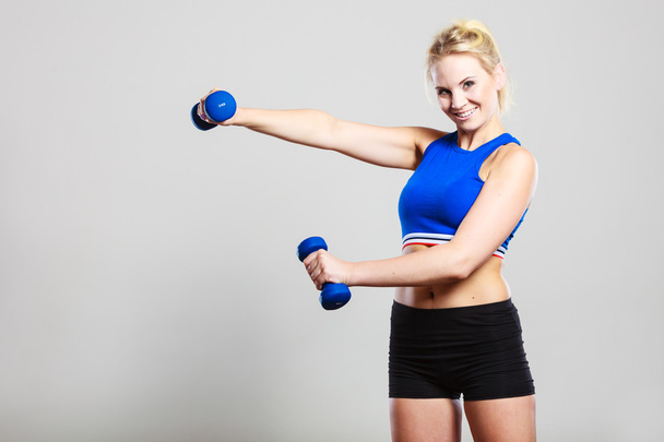 Fit woman lifting dumbbells weights - Foto, imagen