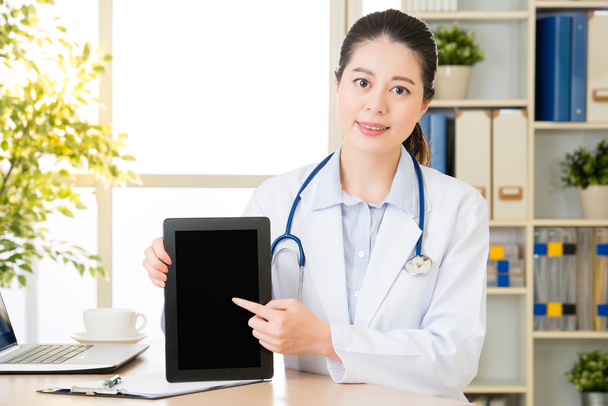 doctor using digital tablet to show patient's medical case - Photo, Image