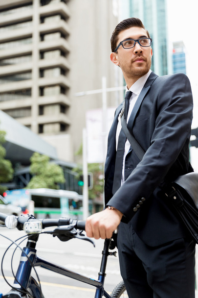 Young businessmen with a bike - Фото, изображение
