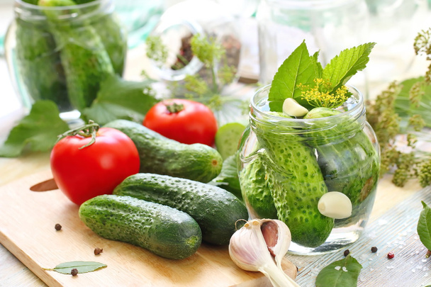 Homemade pickles in jar. Preserving pickled cucumbers. - Фото, зображення