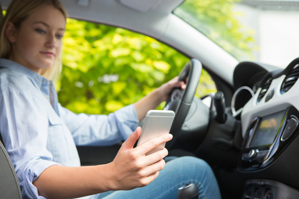 Woman In Car Texting On Mobile Phone Whilst Driving - Photo, image