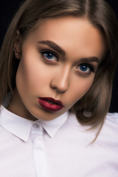 Close portrait of beautiful girl with blue eyes and perfect skin - Fotó, kép