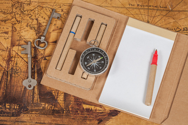 Compass with note book on old map vintage process style - Foto, Imagem