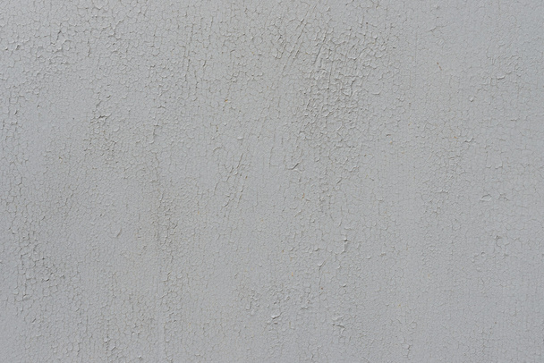Metal texture with scratches and cracks which can be used as a background - Φωτογραφία, εικόνα