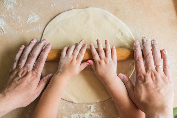 Children and dad hands rolled dough - Photo, Image