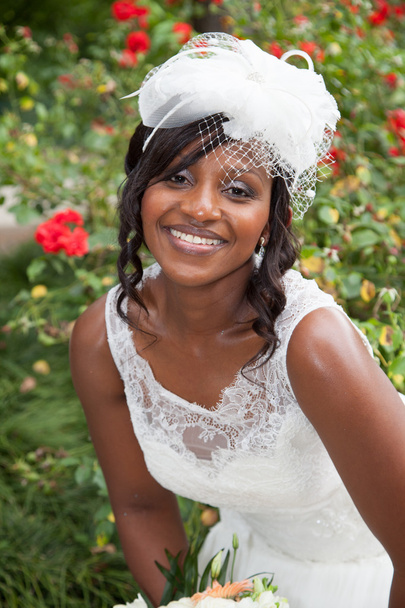 Wedding. Beautiful and smiling bride african with bouquet - Photo, Image