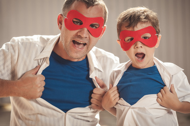 Father and son playing superhero outdoors at the day time. - Foto, Imagem