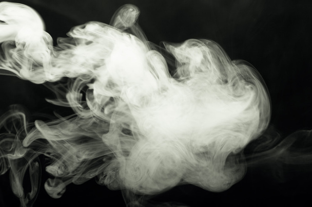 Cloud of smoke on black background. Selective focus. Toned - Fotografie, Obrázek