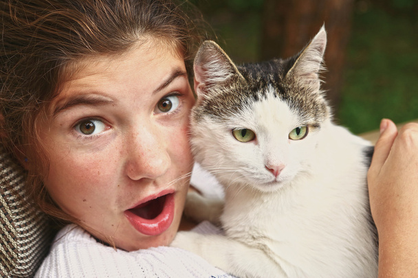 teen girl hug cat close up portrait - Photo, Image