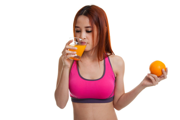 Beautiful Asian healthy girl with orange juice and orange fruit. - Photo, image