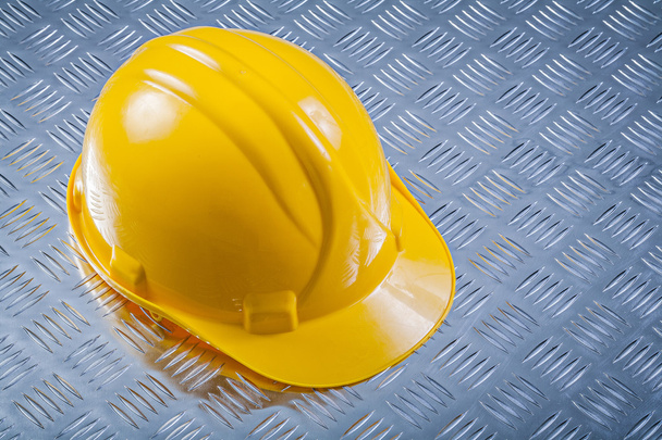Hard hat on grooved metal plate  - Photo, image
