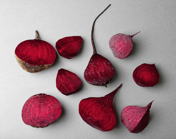 Fresh beetroot cut half on grey background, top view - Photo, Image