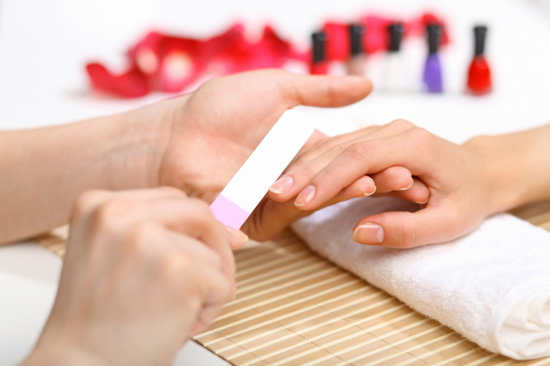 Woman is getting manicure - Zdjęcie, obraz