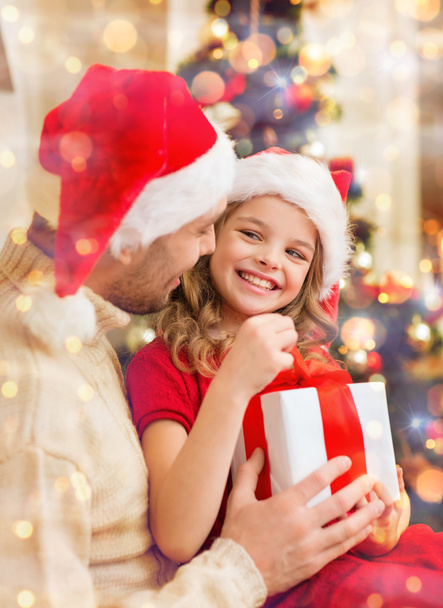smiling father and daughter opening gift box - Foto, Imagen
